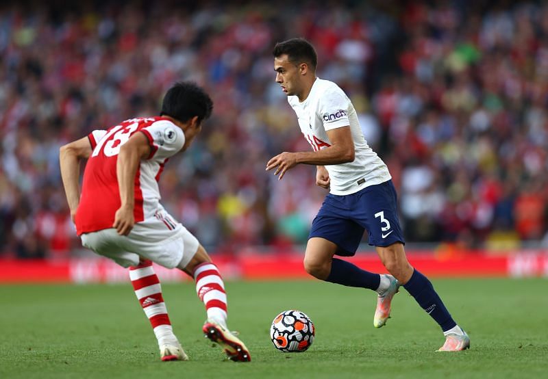 Arsenal defender Takehiro Tomiyasu faces up against Spurs' Sergio Reguilon (right).